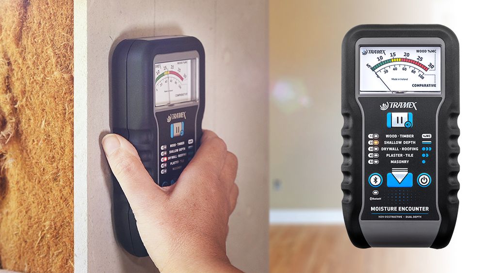 Moisture meter used to assess a wall for hidden water damage