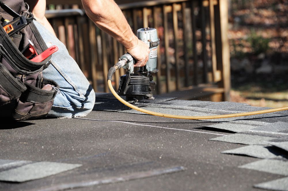 Restoration technician setting up equipment during a water damage cleanup